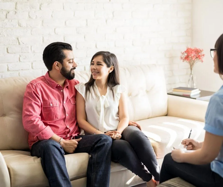 Compassionate therapist engaging in a supportive counseling session with a client