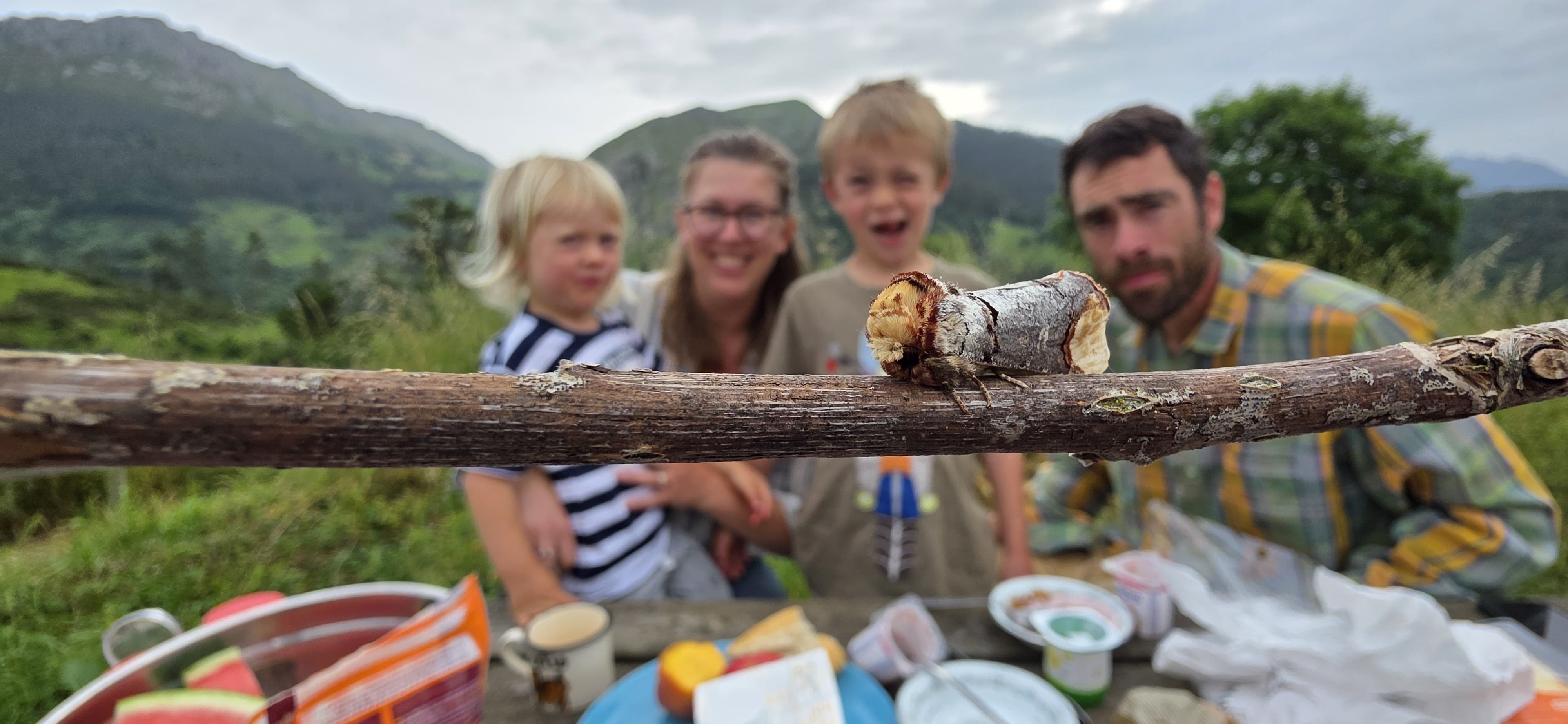 Katie and her family having breakfast with a moth