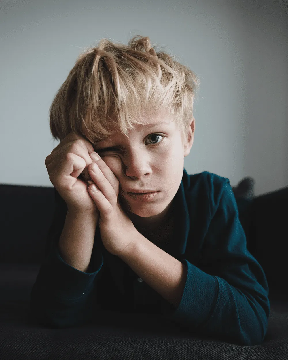Young boy showing signs of reading frustration and fatigue, seeking early dyslexia support in the Wellington region