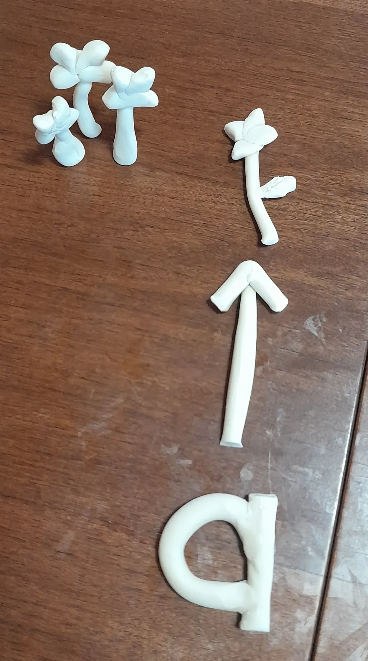 Davis Symbol Mastery clay model of the word "a" used to resolve dyslexic disorientation and build mental anchors for abstract words