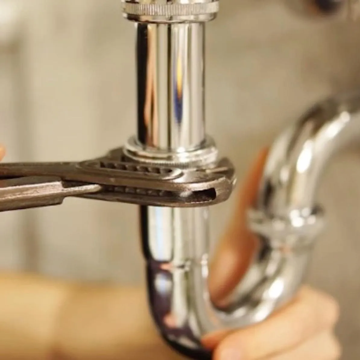 Advantage HPE plumber completing residential plumbing service for a homeowner on the Emerald Coast of Florida.