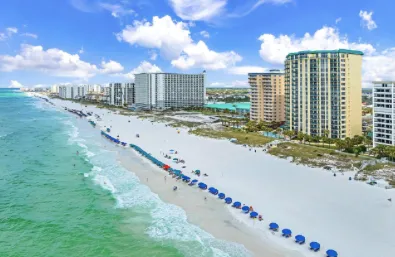Aerial view of Destin Florida beachfront with white sand beaches, emerald water, and coastal condominiums
