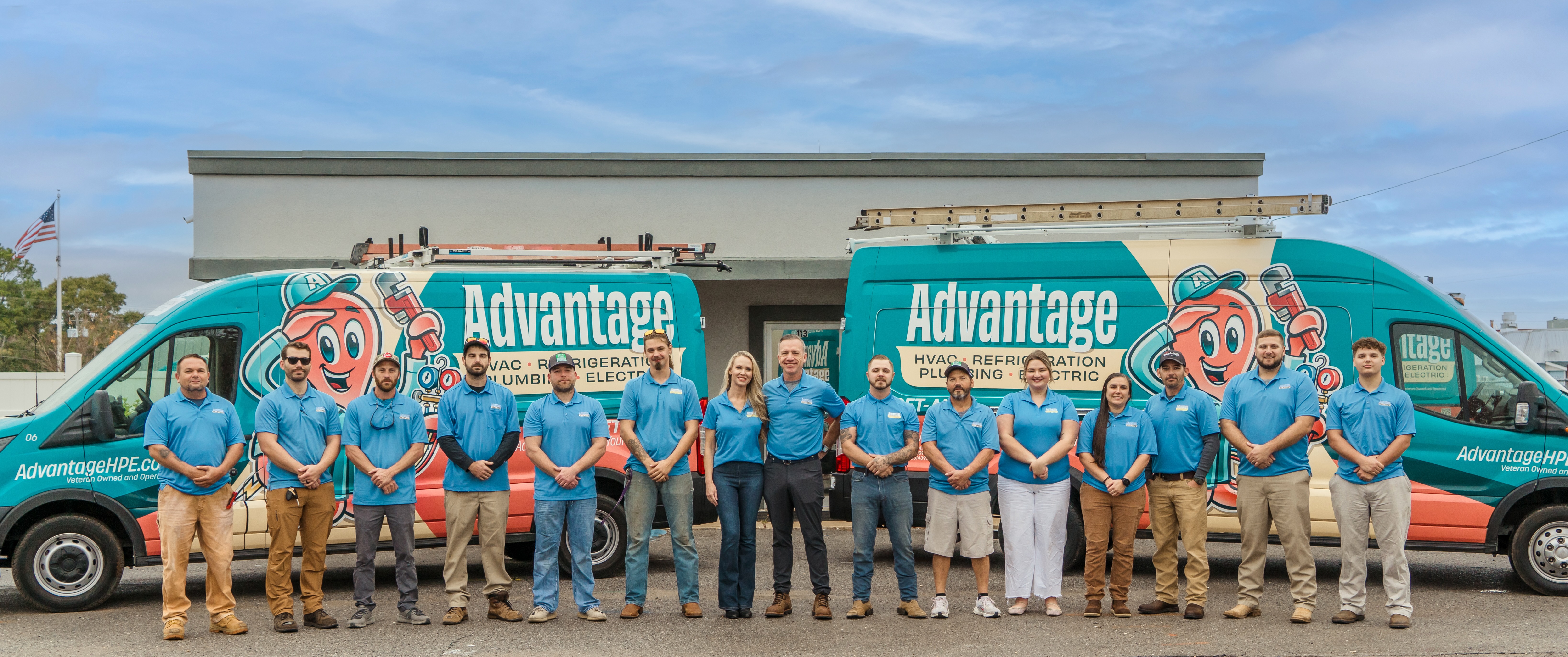 Advantage HPE team standing in front of company service vehicles, providing HVAC, plumbing, and electrical services across the Emerald Coast of Florida.