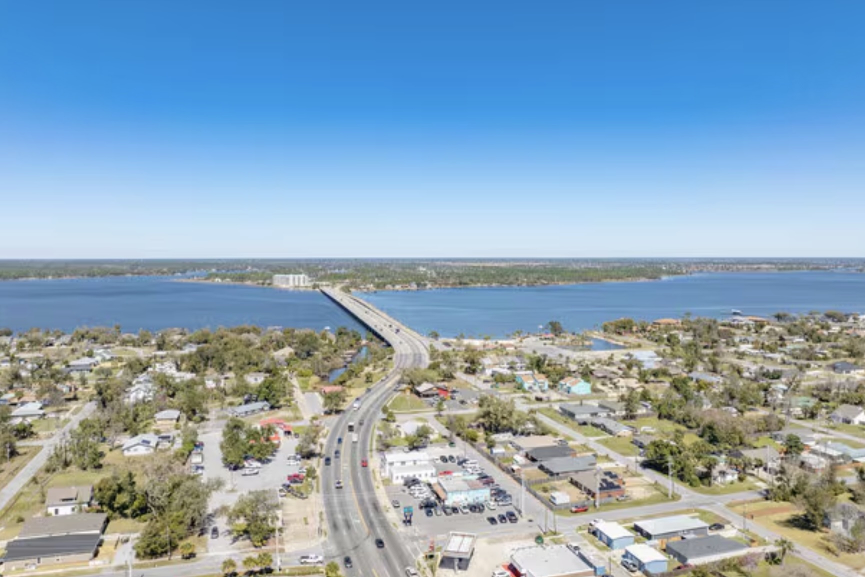 Aerial view of Lynn Haven, Florida showing residential neighborhoods, roadway, and bridge over North Bay