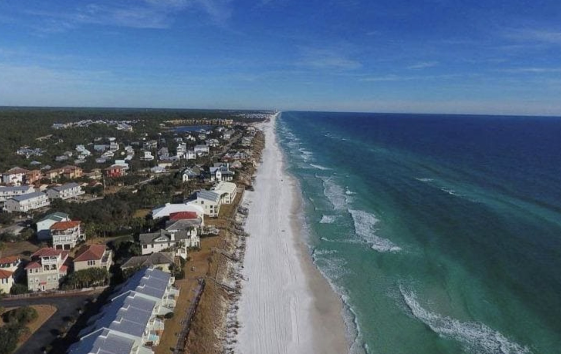 Blue Mountain Beach Florida beachfront community with luxury homes along the emerald green Gulf waters