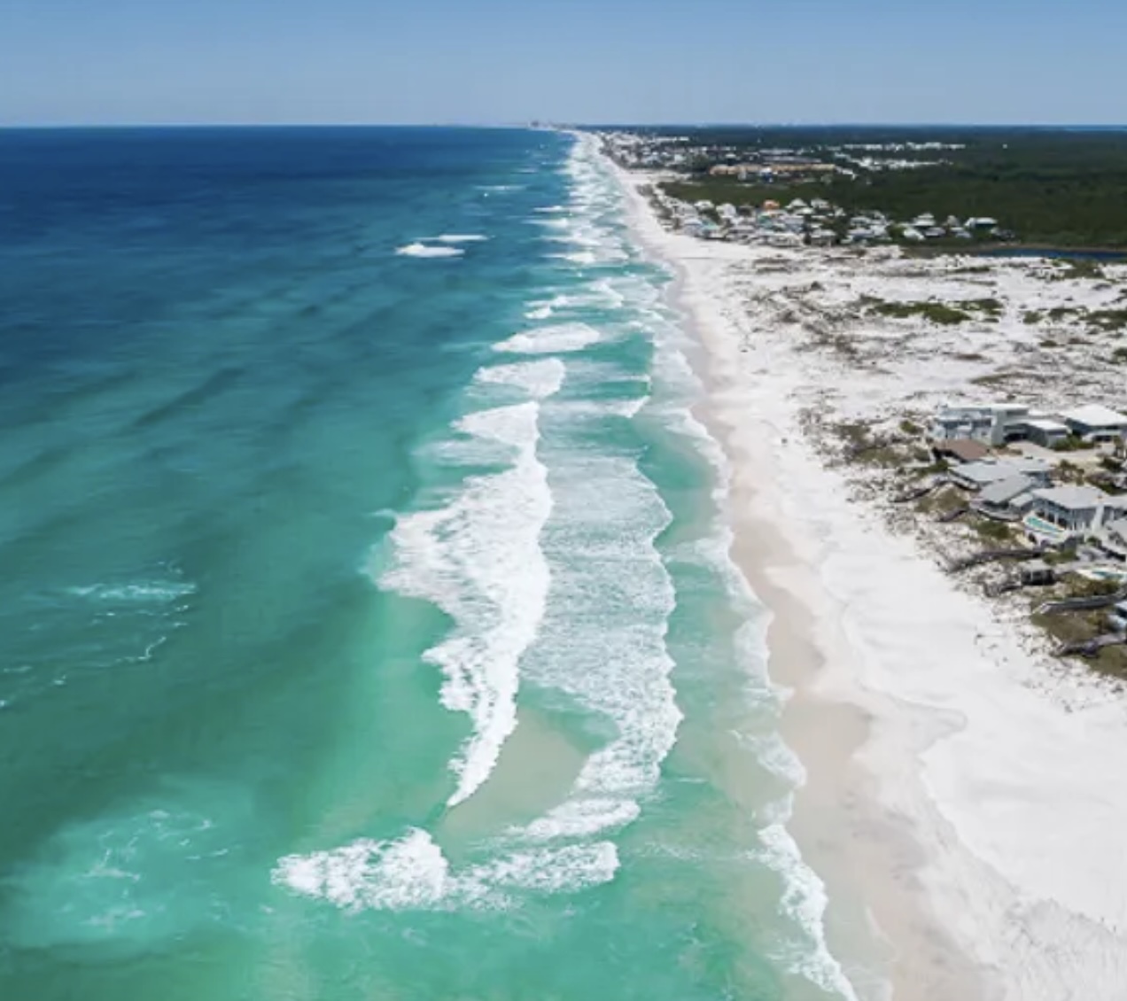 Aerial view of Seagrove Beach, Florida coastline with turquoise Gulf waters, white sand beach, and coastal homes along Scenic Highway 30A