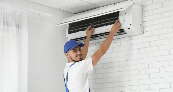 Advantage HVAC, Plumbing, and Electrical techician working on a ductless heating system
