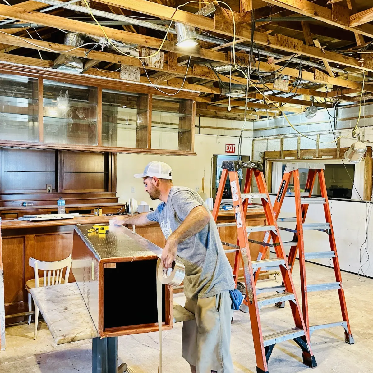 Advantage HVAC, Plumbing, and Electrical technician installing ductwork