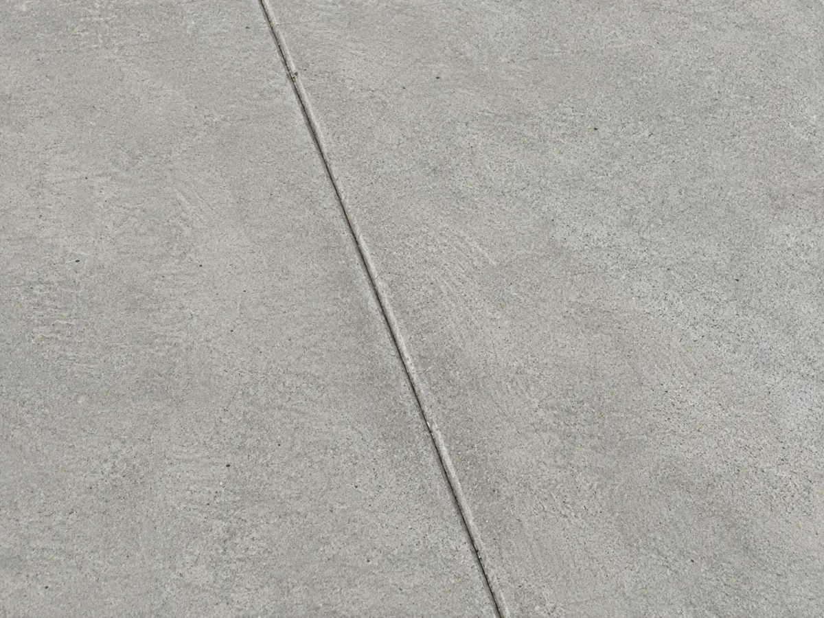 Clean standard concrete driveway finish with smooth durable surface.