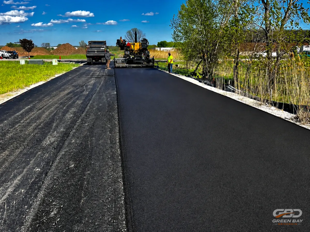 Asphalt road overlay project being applied to existing roadway