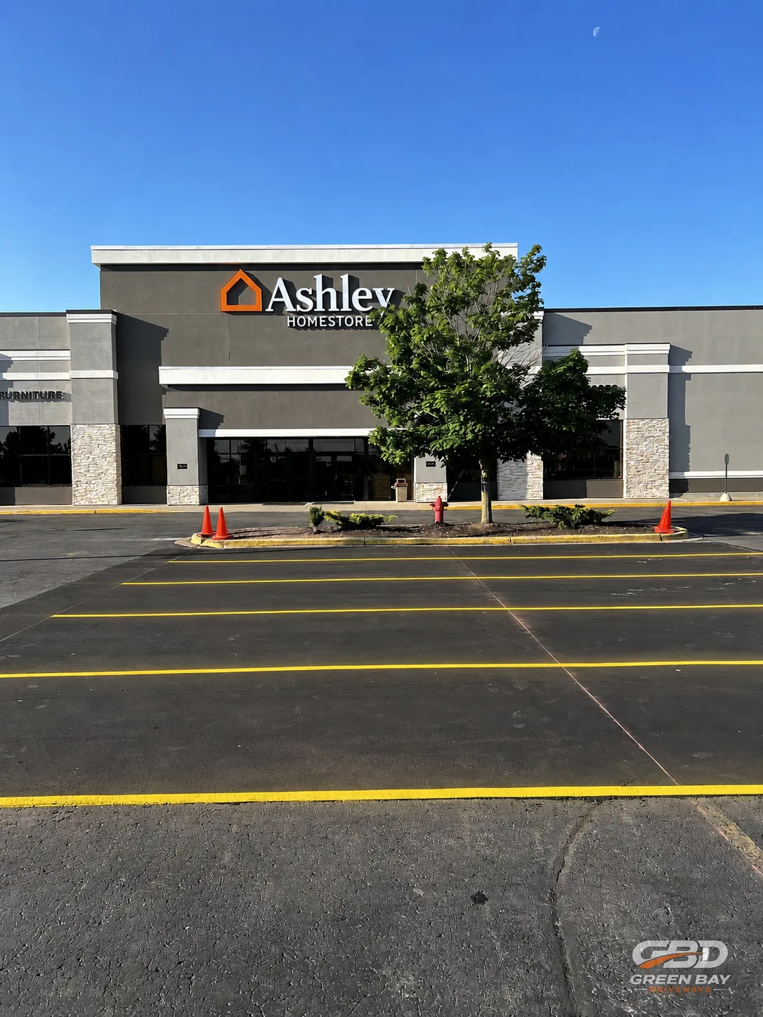 Asphalt patch repair completed at Ashley Furniture store location