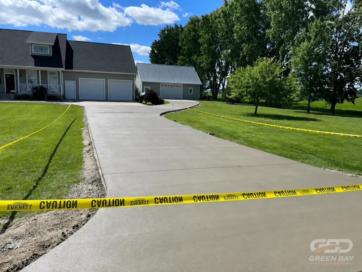 Freshly poured concrete driveway being installed for a residential property in Green Bay, WI