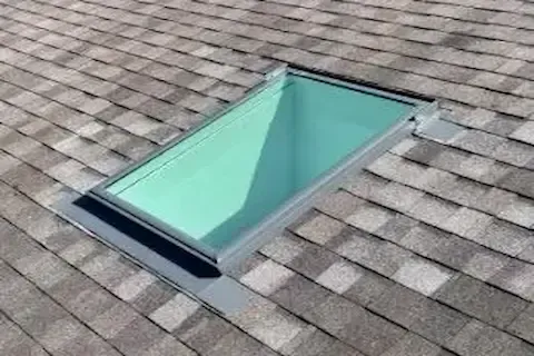 Skylight installation on asphalt shingle roof in Brooklyn Park by Brooklyn Park Roofing Co