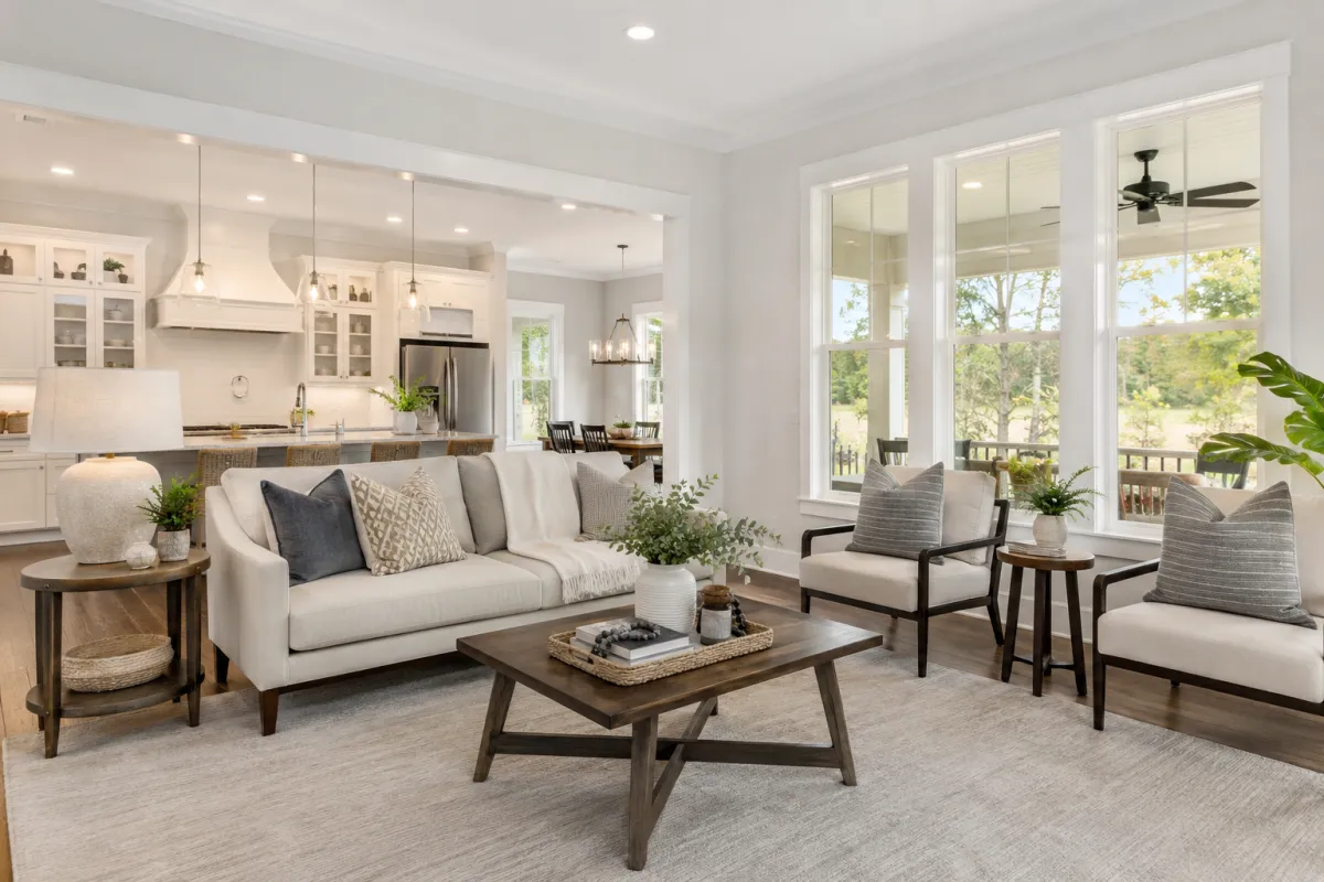 Bright staged living room and dining space with clean decor and natural light.