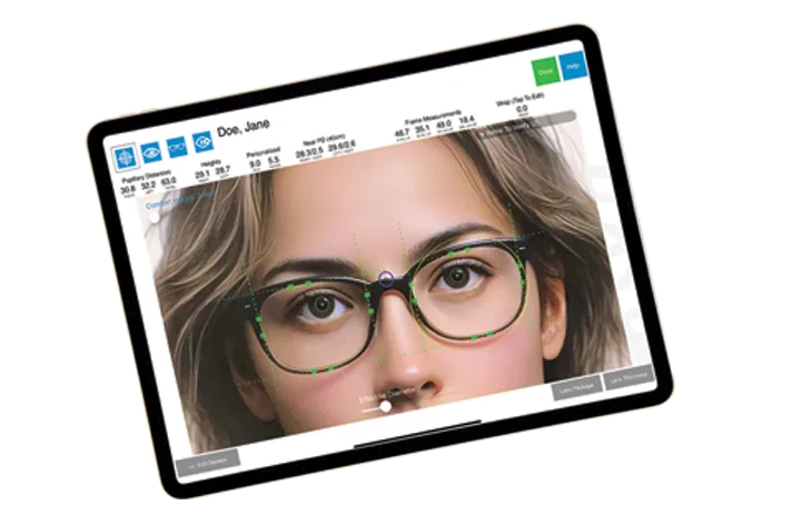 Optometrist performing an eye exam for a seated patient using clinical equipment