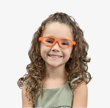 Smiling child wearing bright orange flexible eyeglass frames