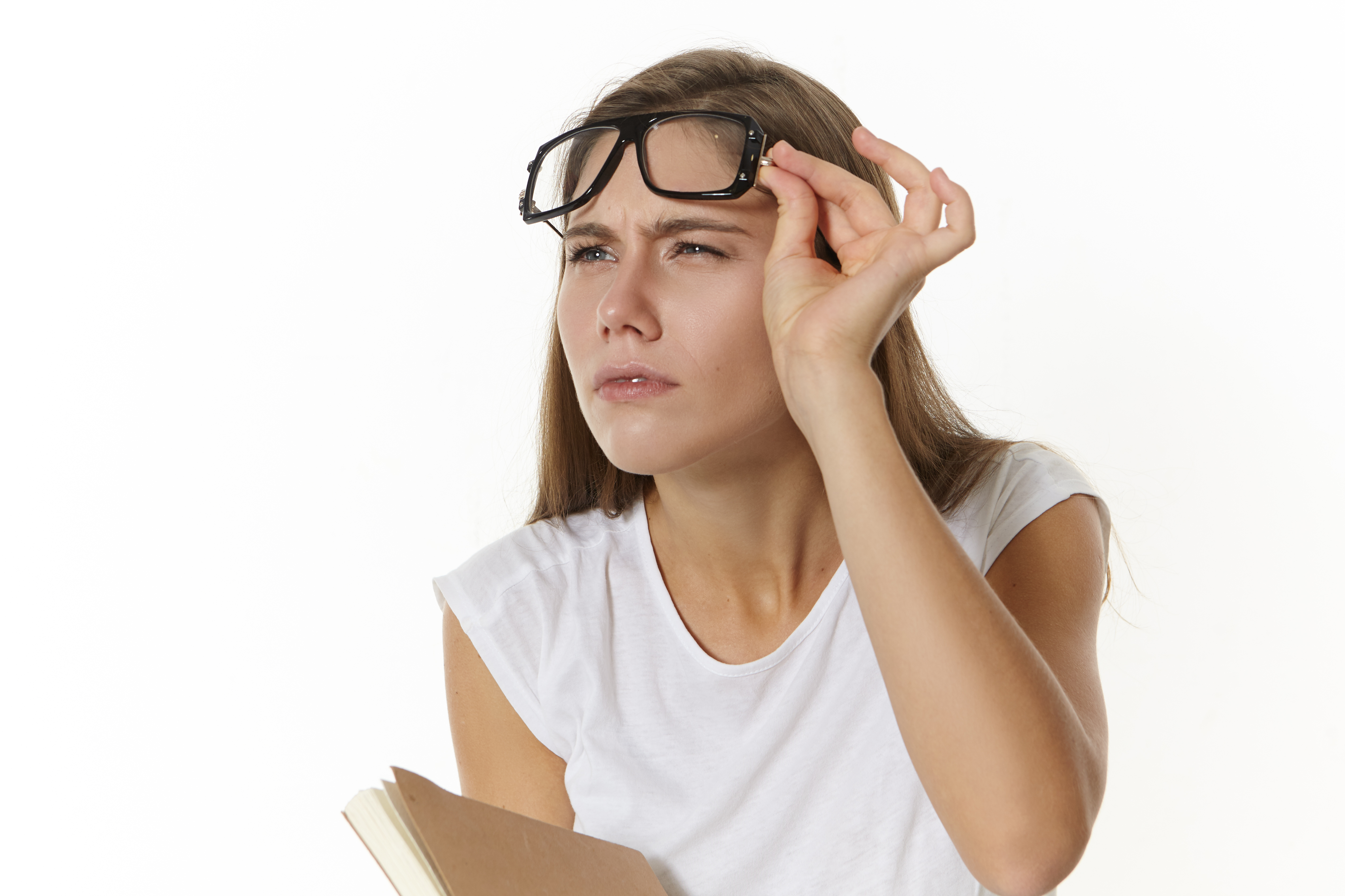 Woman receiving an eye exam with a retinal light check