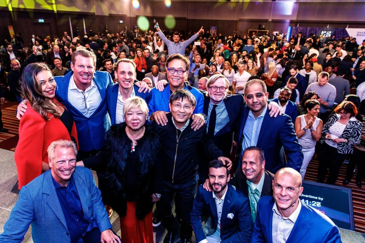 Alan P. Hill on stage with Robert Kiyosaki & Rich Dad Advisors