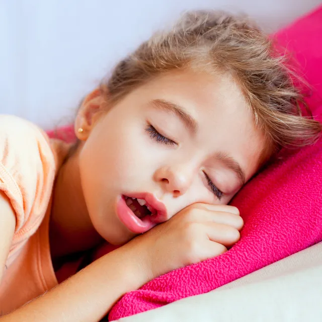 Young girl fast asleep representing support for bedtime battles