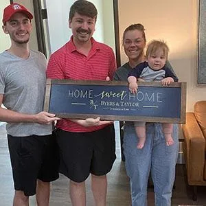 Ben Sharp with a satisfied family in their new home - SBRE Group, your reliable partner in Plano real estate