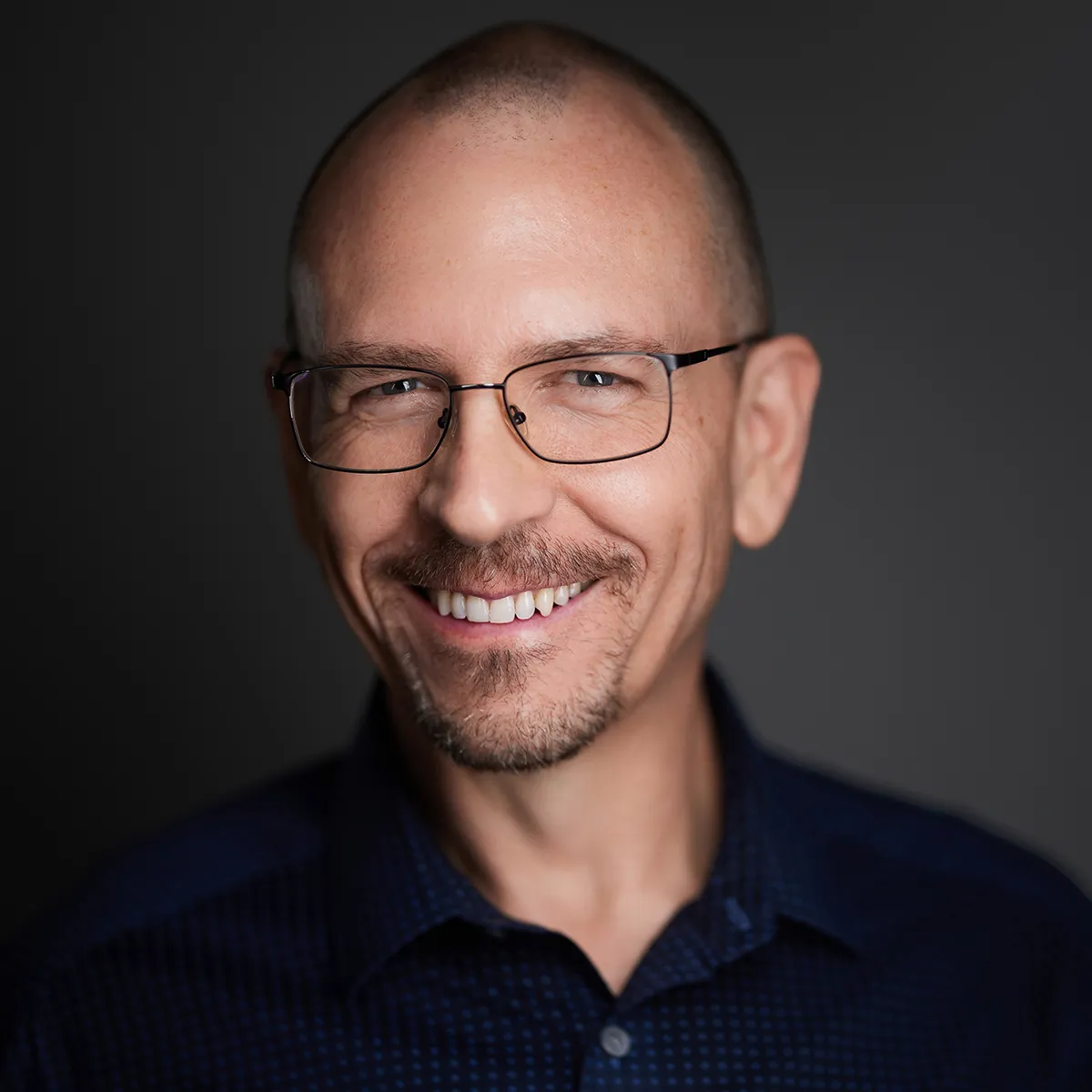 A professional business coach meeting one-on-one with a client, discussing strategies, goals, and actionable plans to support business growth and long-term success.
