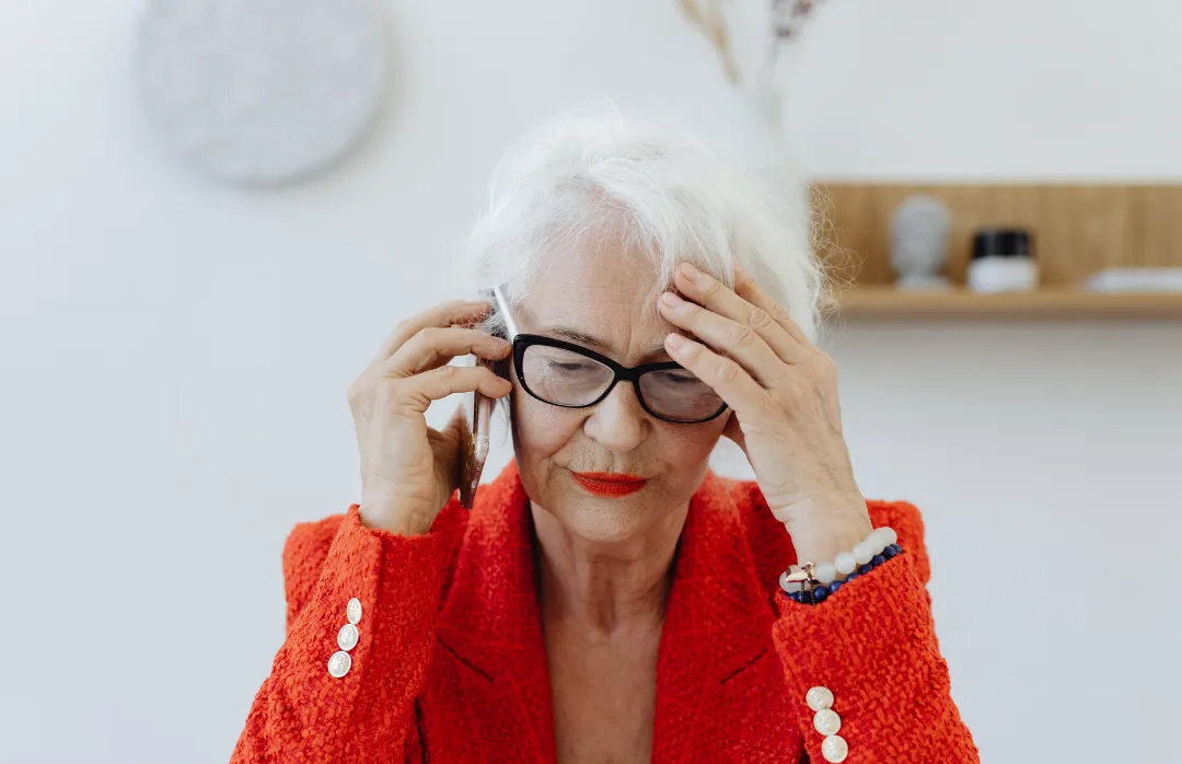 woman placing sticky notes on wall