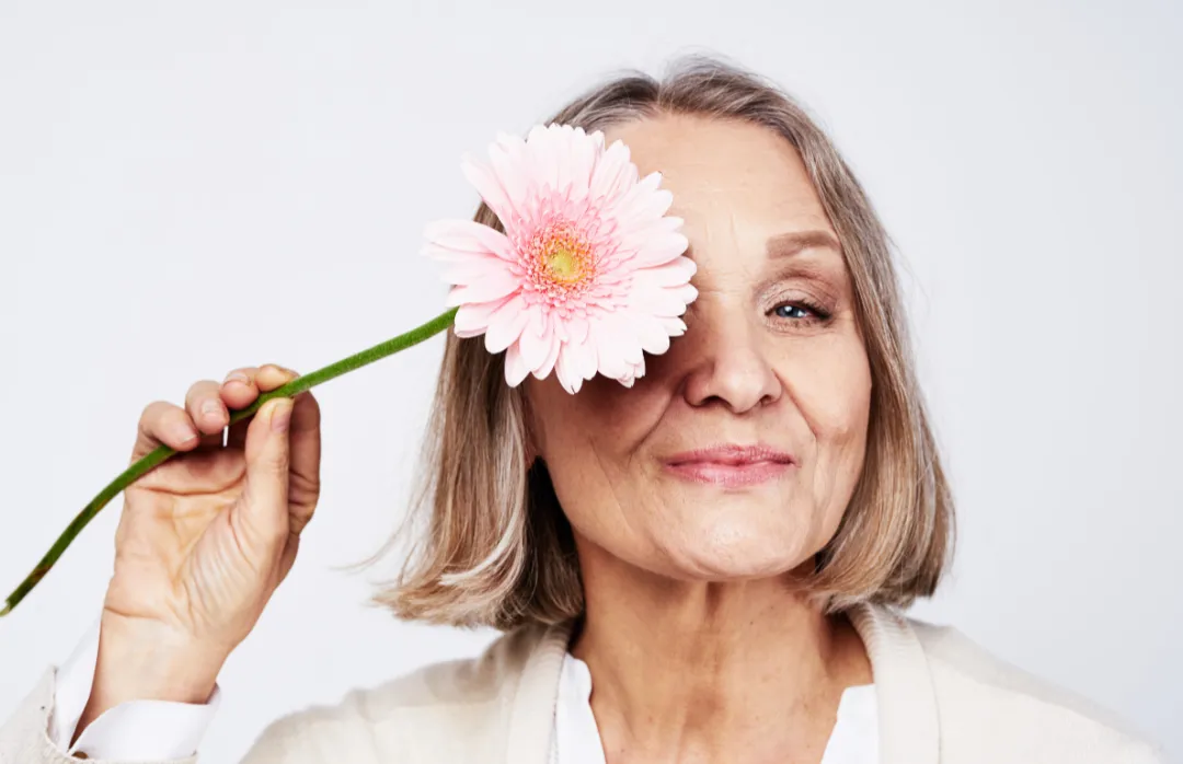 woman placing sticky notes on wall