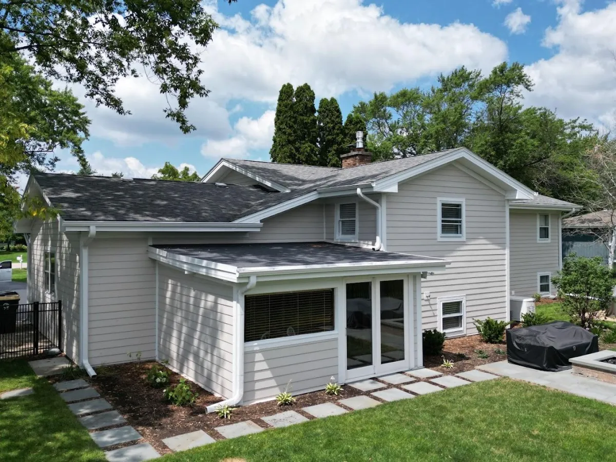 Cobblestone James Hardie siding with Arctic White trim installed on a Lake Forest, IL home by Northwind Exteriors, showcasing classic elegance