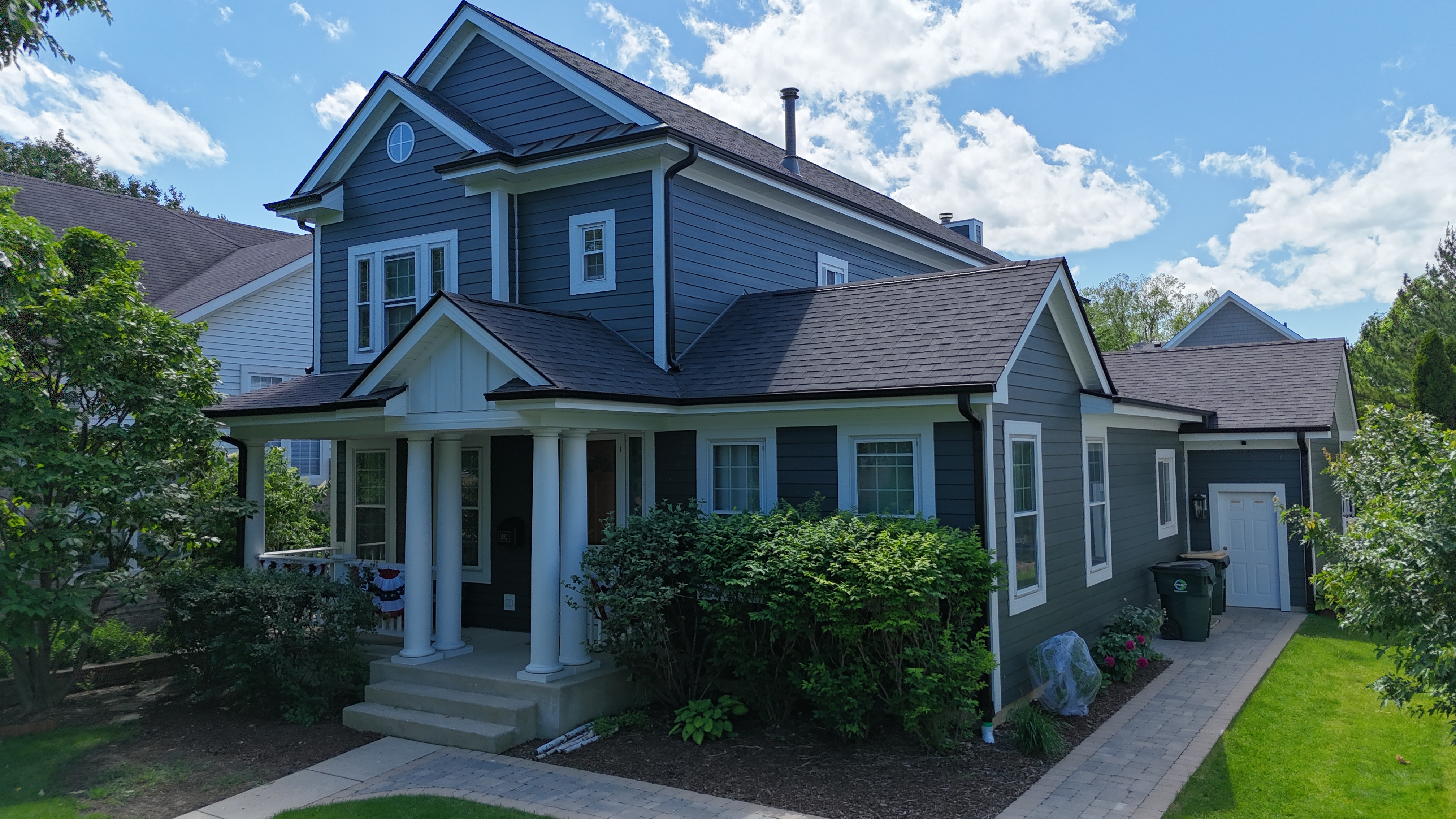 James Hardie siding and Malarkey Brilliant Black roof installed on a Park Ridge, IL home by Northwind Exteriors