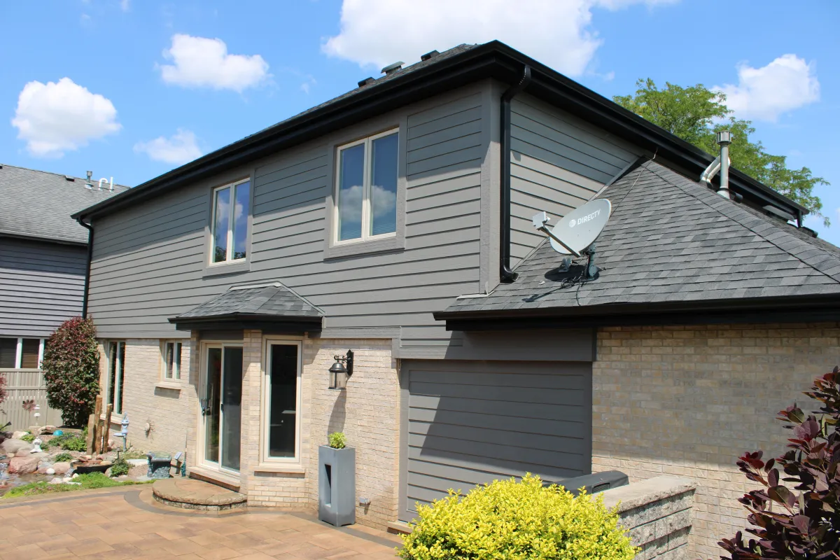 Northwind Exteriors James Hardie siding project in Rosemont, IL featuring sleek and durable Gray siding for a modern and long-lasting home exterior.