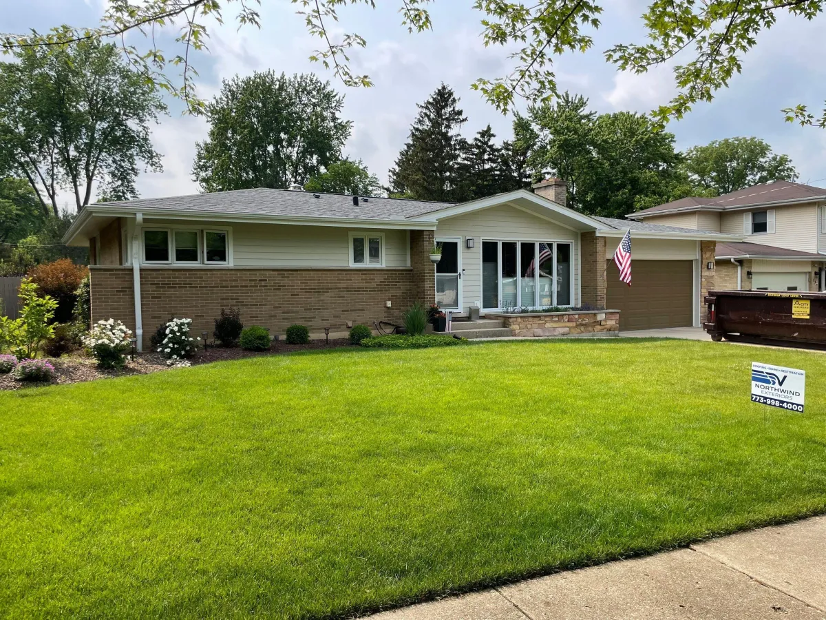 James Hardie siding project by Northwind Exteriors in Palatine, IL featuring Cobblestone siding paired with Arctic White trim, creating a timeless and high-quality home exterior.