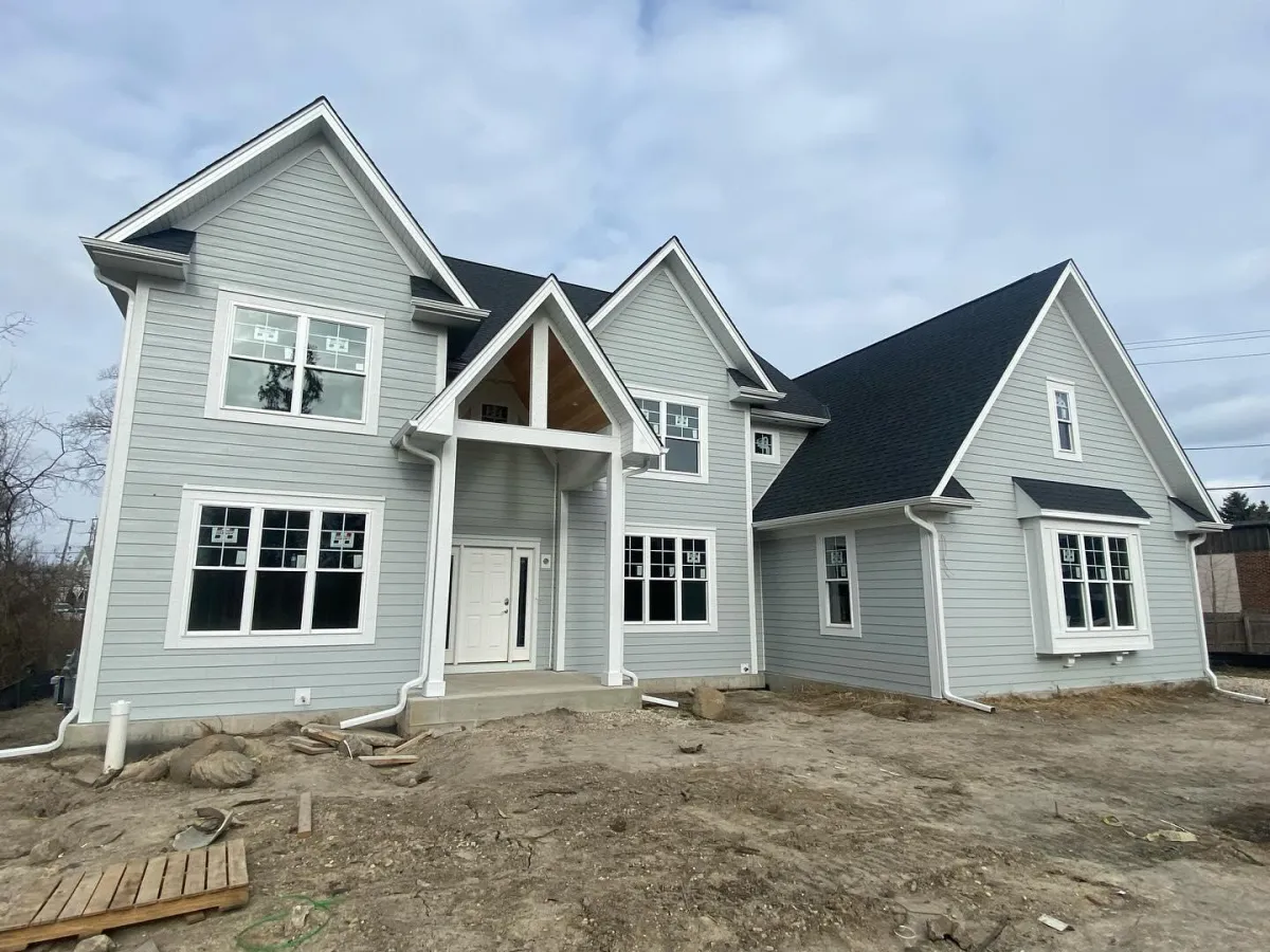 New construction project in Lake Forest, IL by Northwind Exteriors featuring Pearl Gray James Hardie siding with Arctic White trim for a sophisticated and long-lasting home exterior.