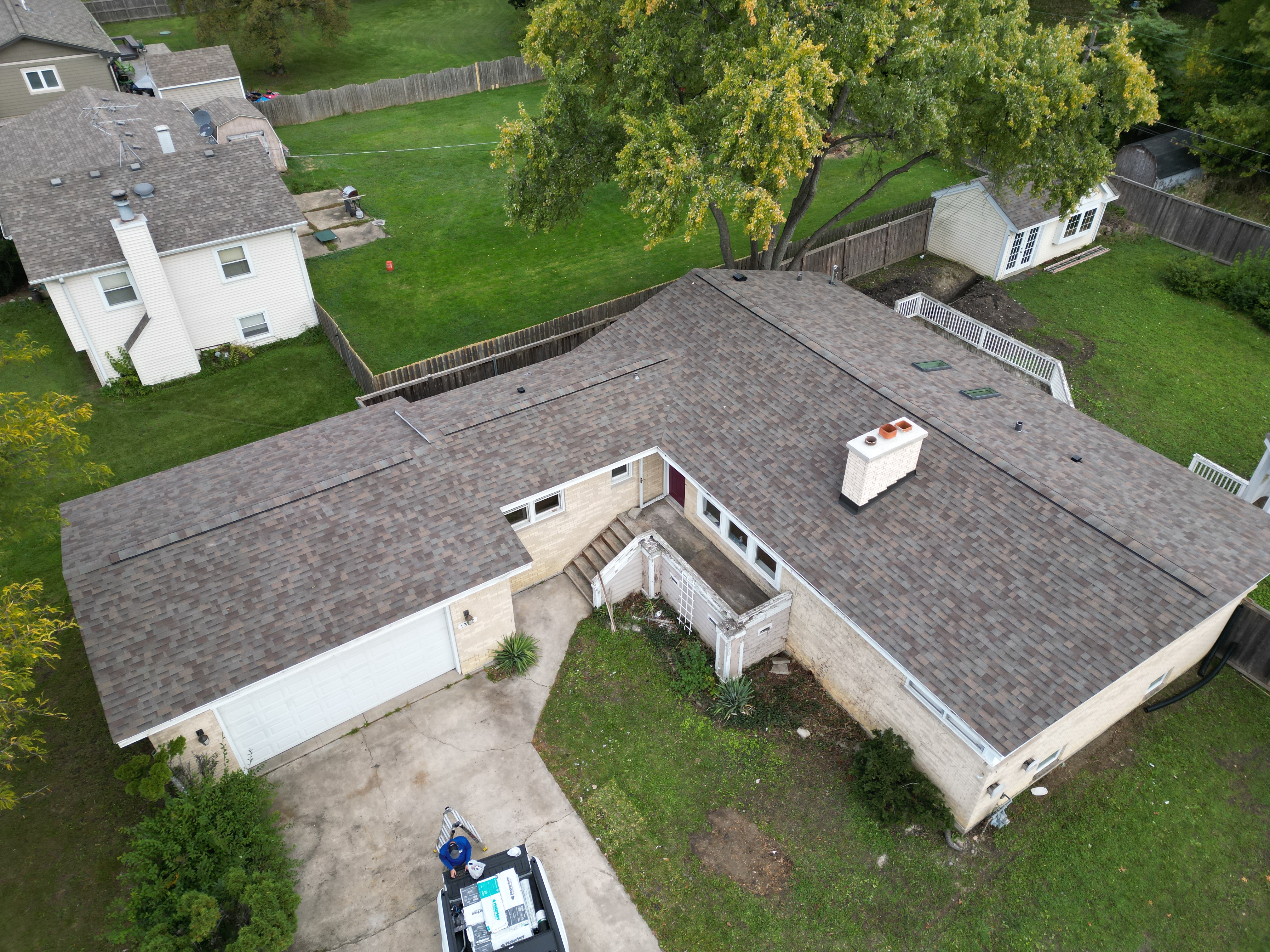 Malarkey Natural Wood shingle roof installed by Northwind Exteriors on a home in Lombard, IL, featuring new Velux skylights and an upgraded high-performance ridge vent for enhanced ventilation and a warm, natural wood-toned aesthetic.