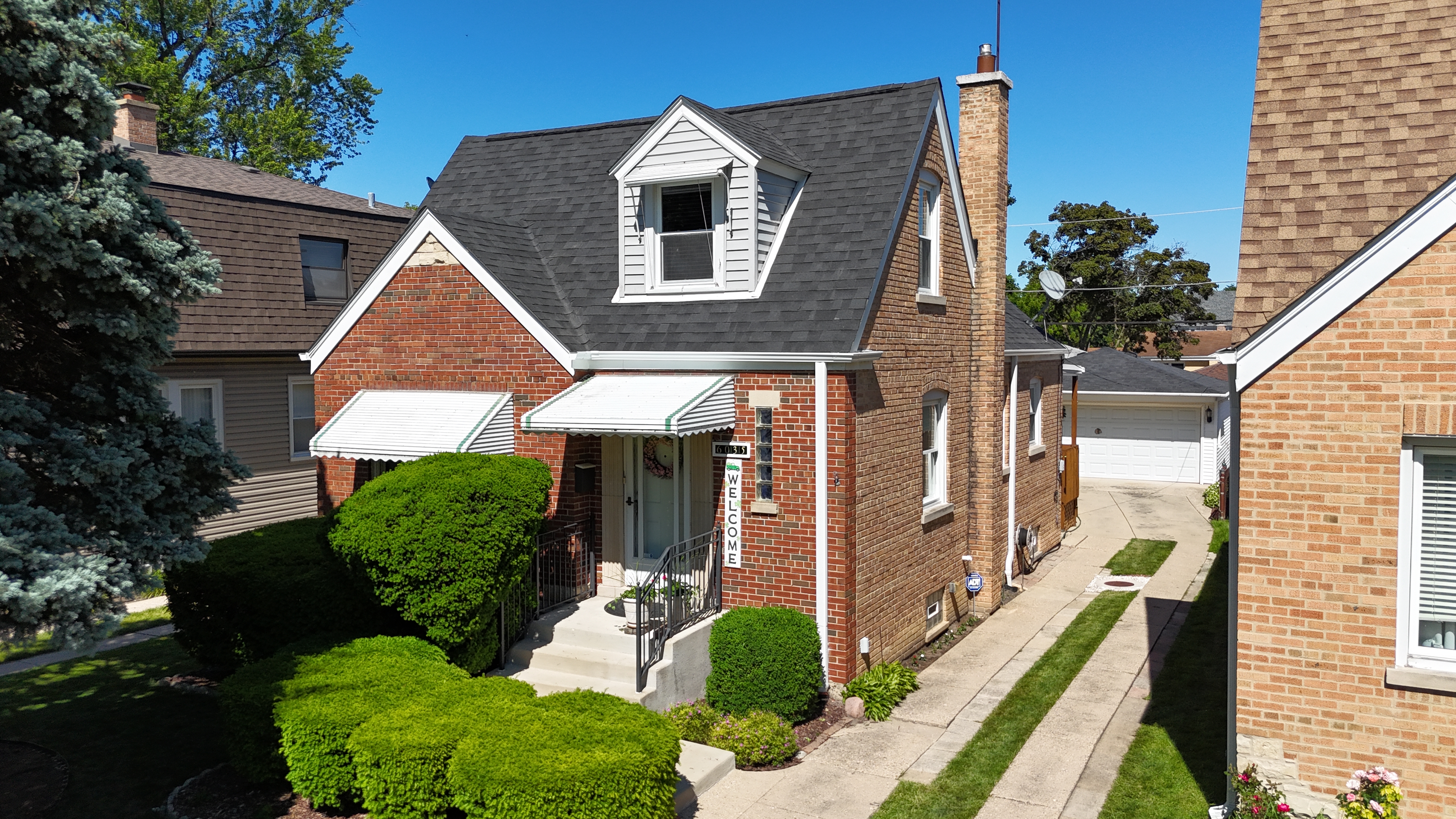 Malarkey Brilliant Black shingle roof installed by Northwind Exteriors on a home in Edison Park, Chicago, enhancing curb appeal and weather resistance.