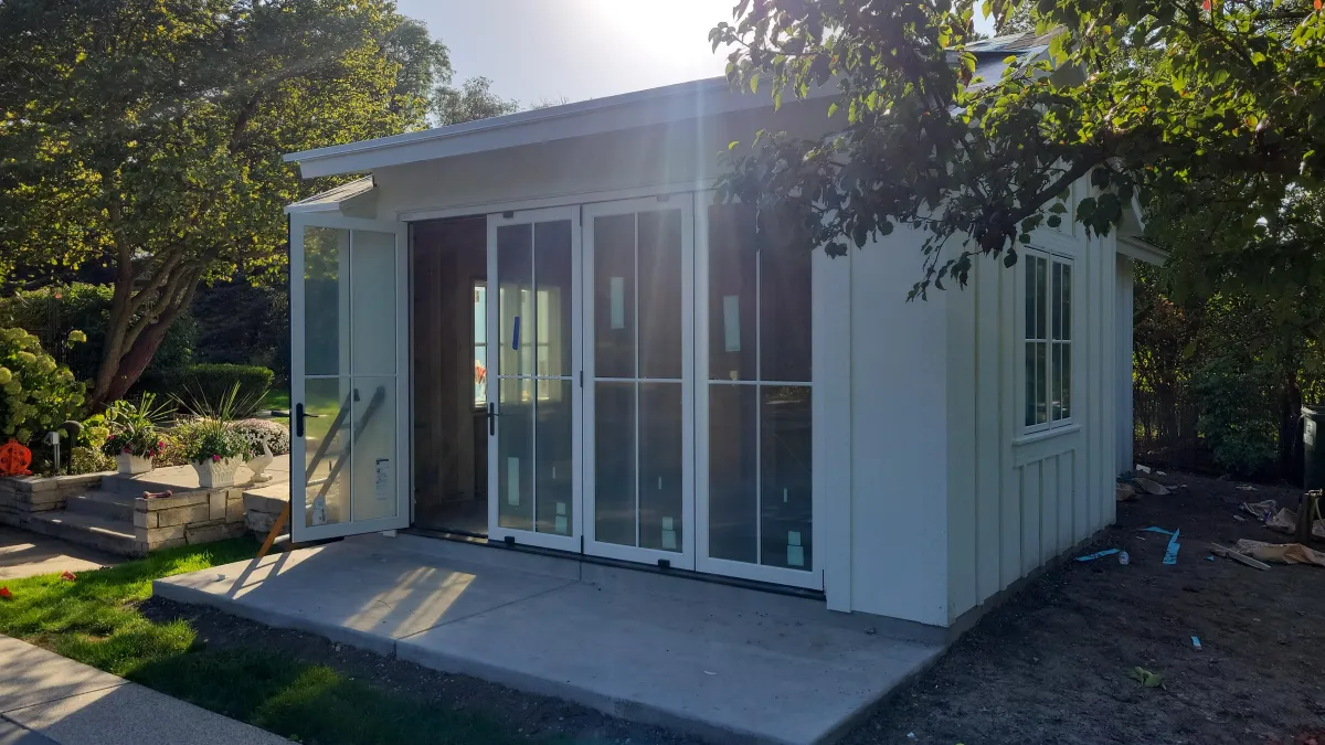 James Hardie Board & Batten in Arctic White with new quad old doors installed by Northwind Exteriors in Glenview, IL 