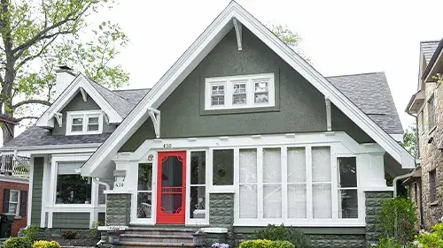 Mountain Sage James Hardie siding with Arctic White trim and a Malarkey Midnight Black roof installed on a historic Sears Catalog Kit home in Park Ridge, IL by Northwind Exteriors.