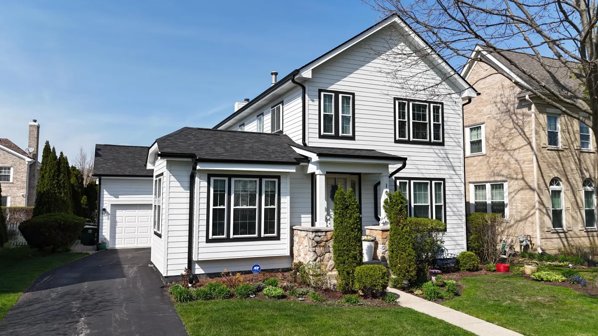 Northwind Exteriors James Hardie siding project in Itasca, IL featuring Deep Ocean siding with Khaki Brown trim, delivering a striking and durable home exterior upgrade.