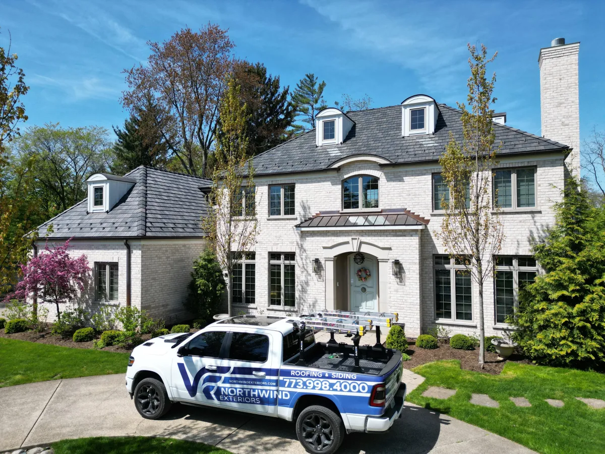Elegant DaVinci Roofscapes composite slate roof installation on a residential home in Park Ridge, IL, showcasing durable, weather-resistant materials with a natural slate appearance.