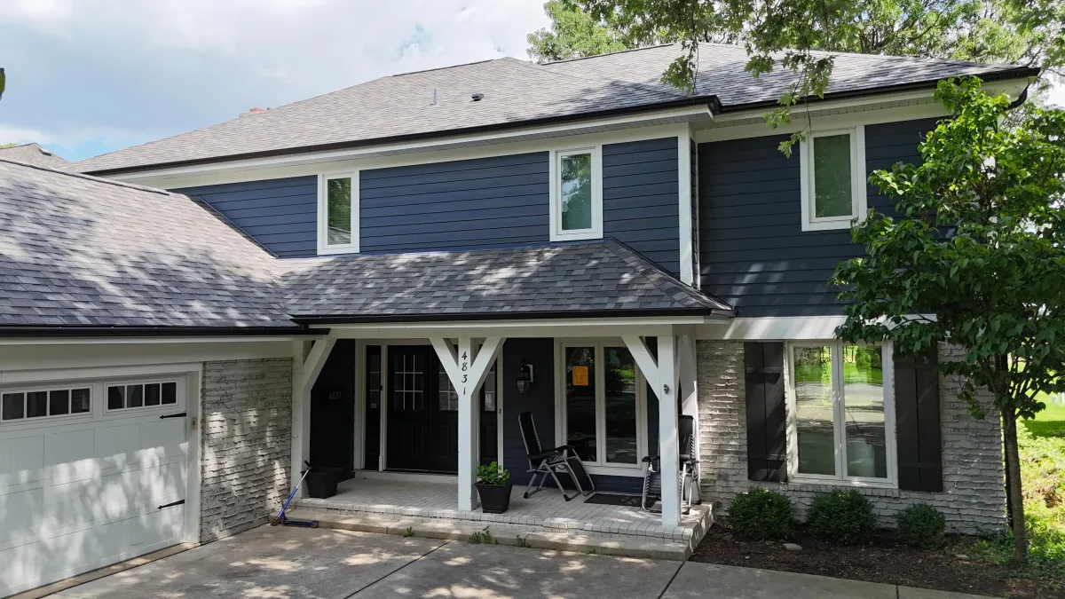 James Hardie siding project in Western Springs, IL featuring Deep Ocean lap siding and James Hardie Arctic White Trim.