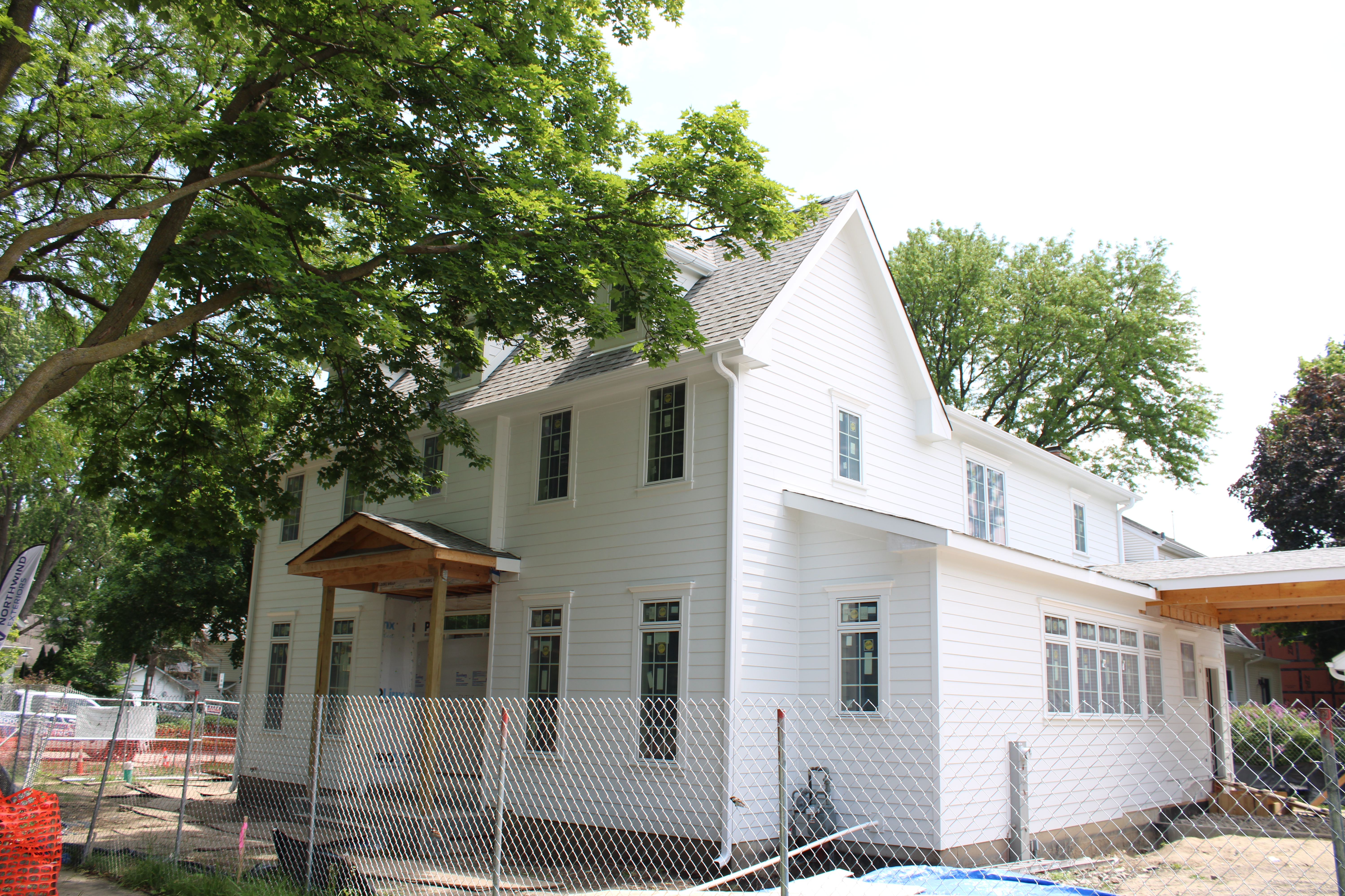 James Hardie Board & Batten in Arctic White with new quad old doors installed by Northwind Exteriors in Glenview, IL