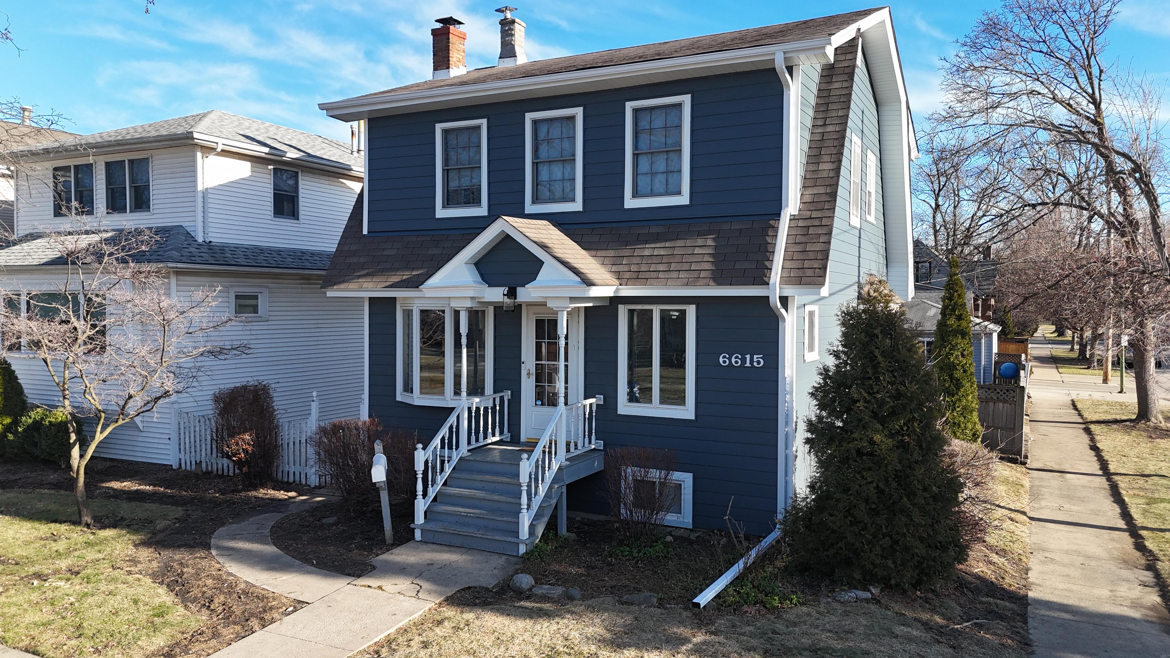 New construction project in Lake Forest, IL by Northwind Exteriors featuring Pearl Gray James Hardie siding with Arctic White trim for a sophisticated and long-lasting home exterior.