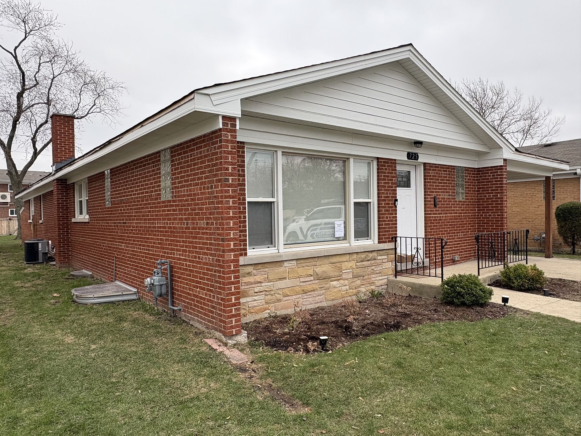 Northwind Exteriors James Hardie siding project in Itasca, IL featuring Deep Ocean siding with Khaki Brown trim, delivering a striking and durable home exterior upgrade.