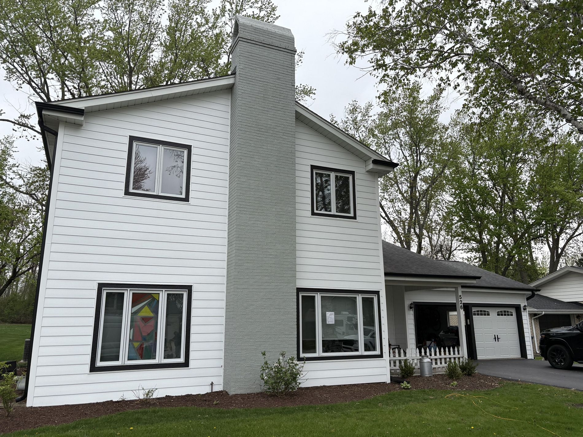 James Hardie siding project by Northwind Exteriors in Palatine, IL featuring Cobblestone siding paired with Arctic White trim, creating a timeless and high-quality home exterior.