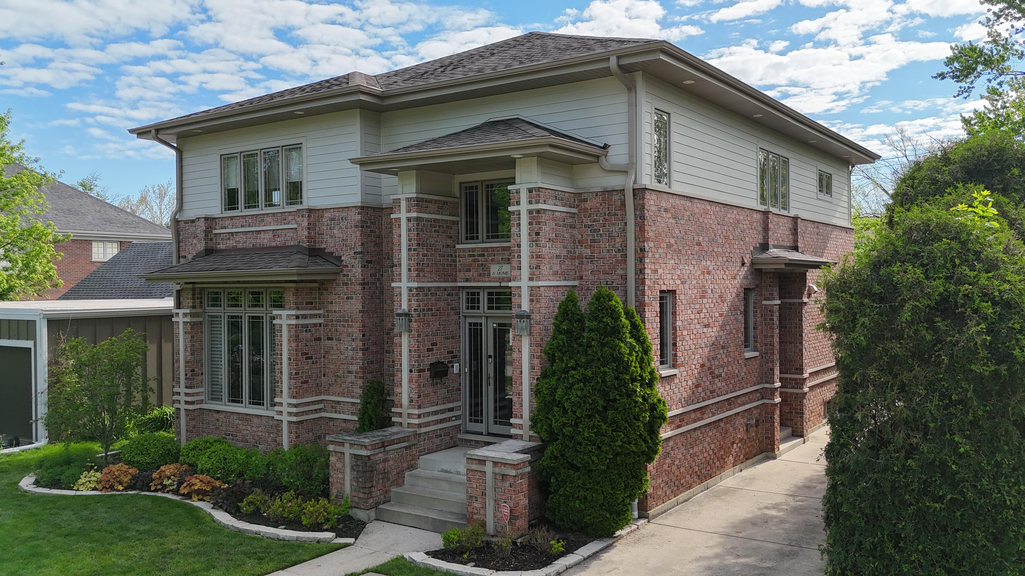 New construction project in Lake Forest, IL by Northwind Exteriors featuring Pearl Gray James Hardie siding with Arctic White trim for a sophisticated and long-lasting home exterior.