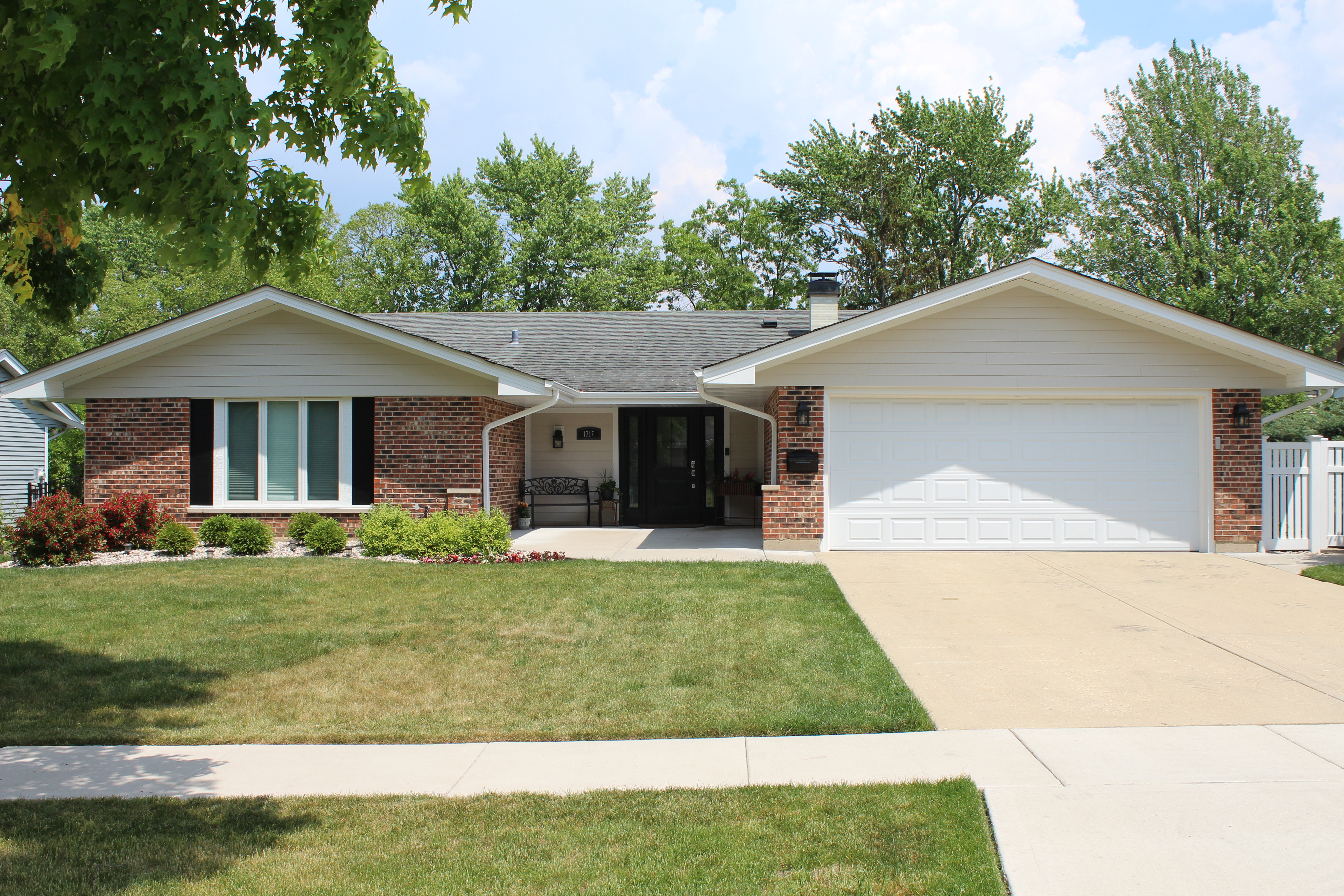 Northwind Exteriors James Hardie siding project in Itasca, IL featuring Deep Ocean siding with Khaki Brown trim, delivering a striking and durable home exterior upgrade.