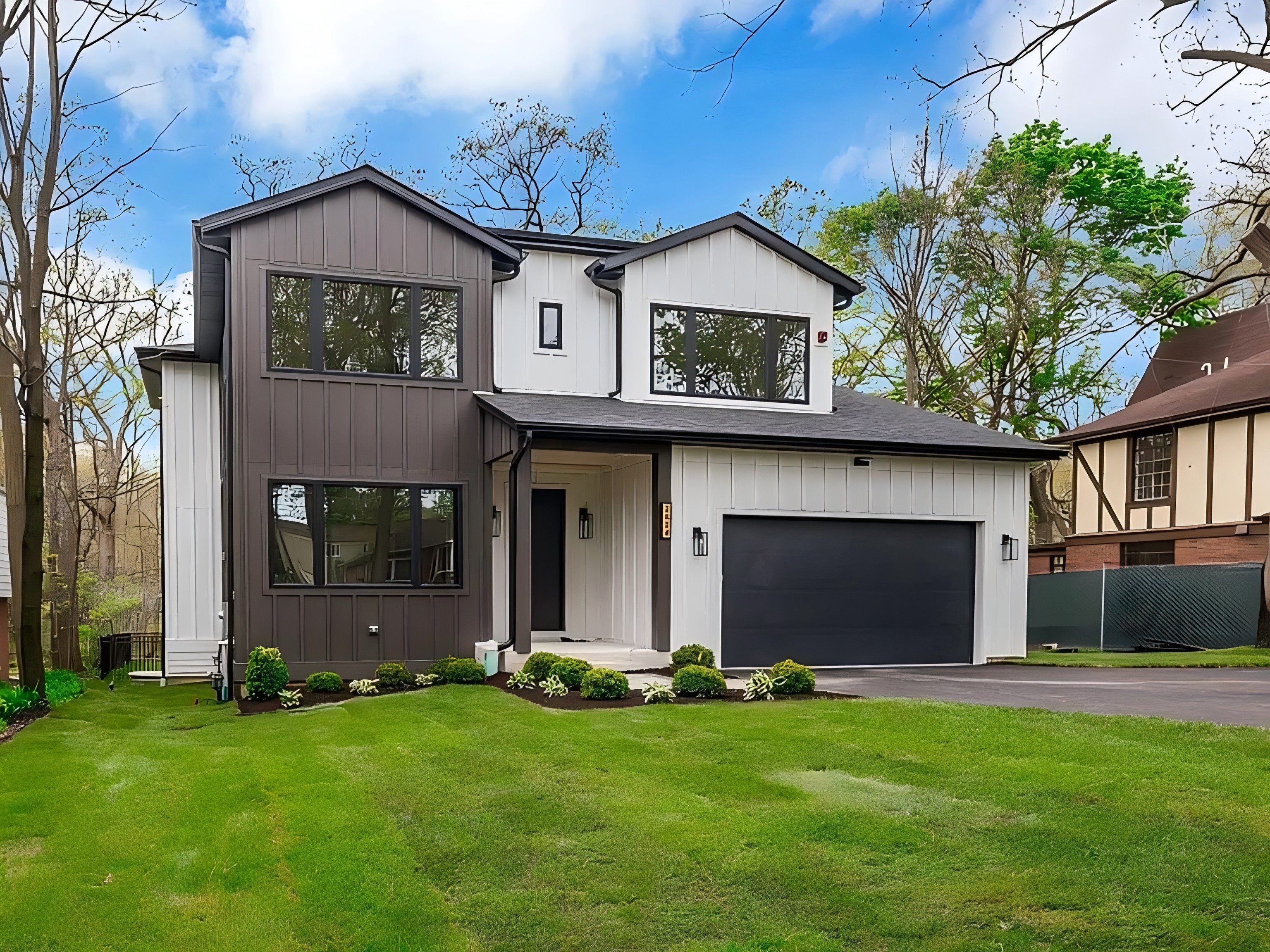 James Hardie siding project in Western Springs, IL featuring Deep Ocean lap siding and James Hardie Arctic White Trim.
