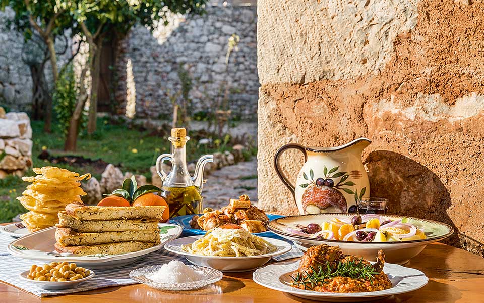 outdoor table set with yumm Greek Food