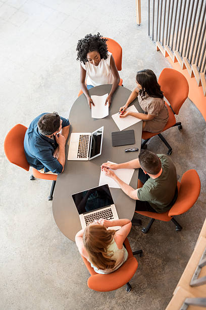 A marketing team sitting around a table coming up with a growth strategy for a local business