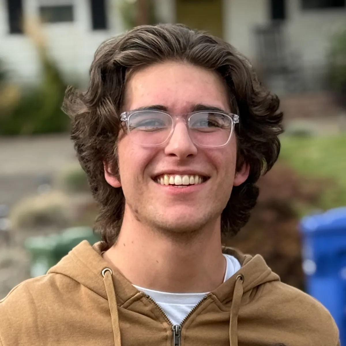 Headshot portrait of a senior founder (mid-40s, friendly, caucasian) half-body, natural window light, neutral office background, approachable smile conveying local leadership and trust.