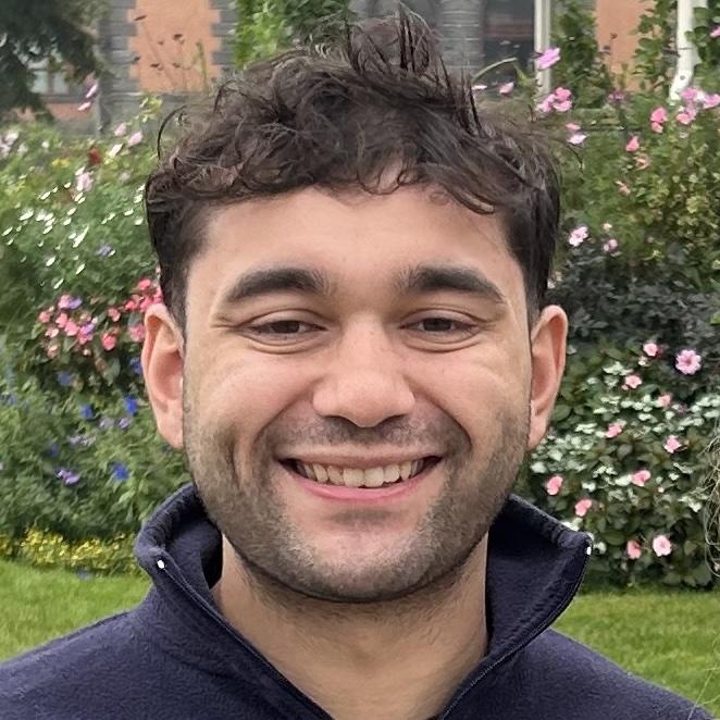 Headshot portrait of a senior founder (mid-40s, friendly, caucasian) half-body, natural window light, neutral office background, approachable smile conveying local leadership and trust.
